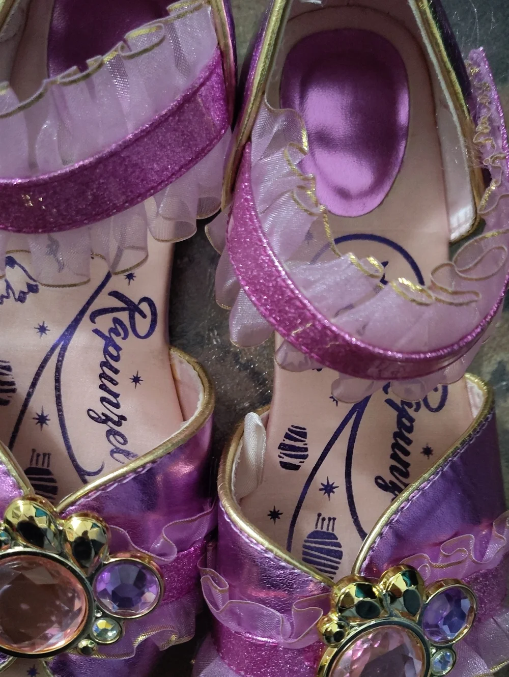2/3 Rapunzel Slippers $25